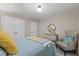 Inviting bedroom with a plush bed, accent chair, and ample natural light at 106 Autumn Cir, Cary, NC 27518