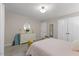 Bright bedroom with twin closets, and dresser, and a pastel bedspread at 106 Autumn Cir, Cary, NC 27518