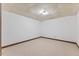 Minimalist bedroom featuring neutral carpet, and white walls at 106 Autumn Cir, Cary, NC 27518