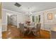 Charming dining room with hardwood floors, modern chandelier, and bright, airy ambiance at 106 Autumn Cir, Cary, NC 27518