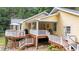 Multi-level deck featuring a grill, outdoor seating, and lush landscaping, perfect for outdoor enjoyment and entertaining at 106 Autumn Cir, Cary, NC 27518