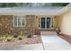 Close up view of the charming front entrance with stone details and a covered entryway at 106 Autumn Cir, Cary, NC 27518
