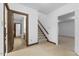 Inviting hallway with stairs, access to bathroom and other rooms with neutral color palette at 106 Autumn Cir, Cary, NC 27518
