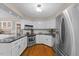 Modern kitchen featuring stainless steel appliances, white cabinets, and granite countertops at 106 Autumn Cir, Cary, NC 27518