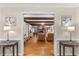 Inviting living room with exposed beams, stone fireplace, and hardwood floors at 106 Autumn Cir, Cary, NC 27518