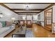 Bright living room featuring exposed wood beams, hardwood floors and neutral decor at 106 Autumn Cir, Cary, NC 27518
