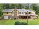Spacious backyard with a large brick chimney and deck perfect for outdoor entertaining at 106 Autumn Cir, Cary, NC 27518