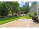 Lush backyard featuring a pergola, patio, and well-kept lawn, perfect for relaxing and entertaining outdoors at 108 Holly Glen Ct, Holly Springs, NC 27540