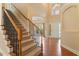 Inviting foyer with hardwood floors, staircase, and arched doorway at 108 Holly Glen Ct, Holly Springs, NC 27540