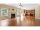 Spacious living room featuring hardwood floors, fireplace, and an open floor plan at 108 Holly Glen Ct, Holly Springs, NC 27540