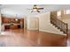 Open living room with hardwood floors leading to a modern kitchen area at 108 Holly Glen Ct, Holly Springs, NC 27540