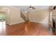 Well-lit living room with hardwood floors, staircase, and fireplace at 108 Holly Glen Ct, Holly Springs, NC 27540
