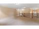 Bright loft with beige carpet, crown molding, and wood-and-metal railing overlooking chandelier at 108 Holly Glen Ct, Holly Springs, NC 27540