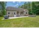 Backyard featuring patio area, a stone fire pit, and green space at 109 Box Elder Way, Zebulon, NC 27597