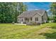Scenic view of the home's backyard, highlighting the patio and spacious lawn at 109 Box Elder Way, Zebulon, NC 27597