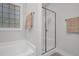 Clean bathroom with a bathtub, shower, and neutral wall colors at 109 Box Elder Way, Zebulon, NC 27597
