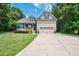 Charming two-story home with a well-manicured lawn and attached two-car garage at 109 Box Elder Way, Zebulon, NC 27597