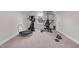 Spacious home gym equipped with various fitness machines and weights at 109 Box Elder Way, Zebulon, NC 27597