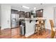 Spacious kitchen with stainless steel appliances, granite counters, and bar seating at 109 Box Elder Way, Zebulon, NC 27597