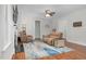 Cozy living room featuring a fireplace, wood floors, and comfortable seating at 109 Box Elder Way, Zebulon, NC 27597