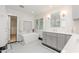 This luxury bathroom features a soaking tub, custom vanity, and patterned tile floors at 109 Murdock Creek Ct, Cary, NC 27519