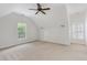 This carpeted bedroom features a ceiling fan and two windows with plantation shutters at 109 Murdock Creek Ct, Cary, NC 27519