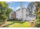 Beautiful backyard with a well maintained lawn, mature trees and lush landscaping at 109 Murdock Creek Ct, Cary, NC 27519