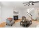 Cozy living room with hardwood floors, fireplace and stairway at 109 Murdock Creek Ct, Cary, NC 27519