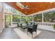 Enjoy this screened in sunroom with wood ceiling, ceiling fan and comfortable seating at 109 Murdock Creek Ct, Cary, NC 27519