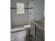 Updated bathroom with walk-in shower, modern vanity, and tile flooring at 1102 N Guthrie Ave, Durham, NC 27703