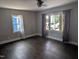 Bedroom with hardwood floors and neutral paint, featuring large windows with curtains at 1102 N Guthrie Ave, Durham, NC 27703