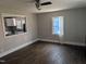 Bright living room with hardwood floors and a passthrough to the kitchen at 1102 N Guthrie Ave, Durham, NC 27703