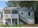 Two-story home featuring a screened porch and exterior access to the basement at 1102 N Guthrie Ave, Durham, NC 27703