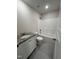 Bathroom with granite countertop vanity and a shower over tub at 111 Hot Springs Way, Benson, NC 27504