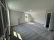 A carpeted bedroom with a window, with light coming through the window at 111 Hot Springs Way, Benson, NC 27504