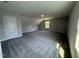 Bedroom featuring soft carpet, natural light from a window, and neutral wall color at 111 Hot Springs Way, Benson, NC 27504