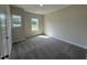 Cozy bedroom with carpet flooring, neutral paint, and double hung windows at 111 Hot Springs Way, Benson, NC 27504