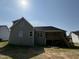 Exterior view of the home and its large back porch with wooden stairs at 111 Hot Springs Way, Benson, NC 27504