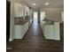 Bright kitchen features granite countertops, white cabinets, and stainless steel microwave above the range at 111 Hot Springs Way, Benson, NC 27504