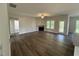 An open-concept living room features a fireplace, a ceiling fan, and is naturally well lit at 111 Hot Springs Way, Benson, NC 27504