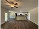 Open concept kitchen and living area with hardwood floors and lots of natural light at 111 Hot Springs Way, Benson, NC 27504