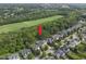 Desirable neighborhood with lush green trees and houses with a community field at 1133 Heritage Greens Dr, Wake Forest, NC 27587