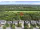 Scenic aerial view showcasing a charming home nestled amidst a wooded landscape at 1133 Heritage Greens Dr, Wake Forest, NC 27587