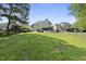 Spacious backyard with a well-manicured lawn and view of surrounding homes at 1133 Heritage Greens Dr, Wake Forest, NC 27587