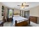 Bedroom with ceiling fan, neutral color walls, carpet, wood frame bed and wardrobe at 1133 Heritage Greens Dr, Wake Forest, NC 27587