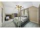 A bedroom with a four poster bed with overhead ceiling fan and a decorative wood dresser at 1133 Heritage Greens Dr, Wake Forest, NC 27587