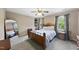 Bedroom with ceiling fan, neutral color walls, carpet, and wooden frame bed at 1133 Heritage Greens Dr, Wake Forest, NC 27587