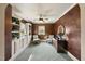 Bonus room features built-in shelving, plush carpet, and natural light at 1133 Heritage Greens Dr, Wake Forest, NC 27587