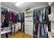 Walk-in closet featuring built-in shelving and hanging rods at 1133 Heritage Greens Dr, Wake Forest, NC 27587