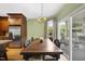 Dining room featuring hardwood floors, neutral decor, and a large dining table at 1133 Heritage Greens Dr, Wake Forest, NC 27587